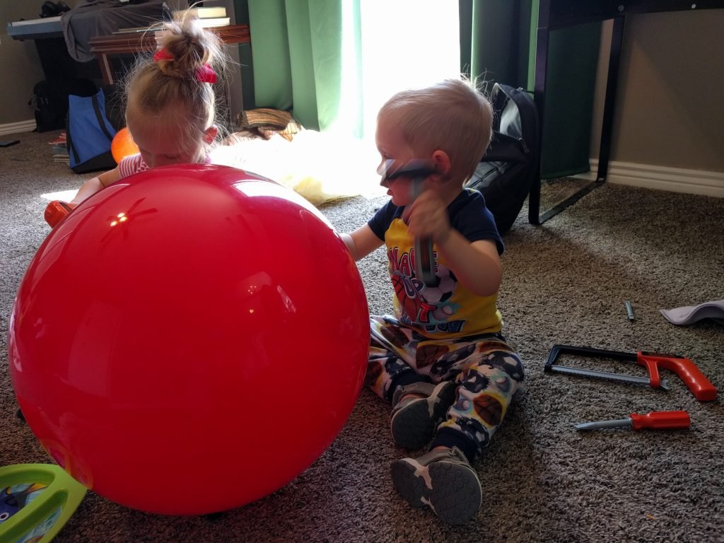Wearing his ball pajamas, playing with his new ball