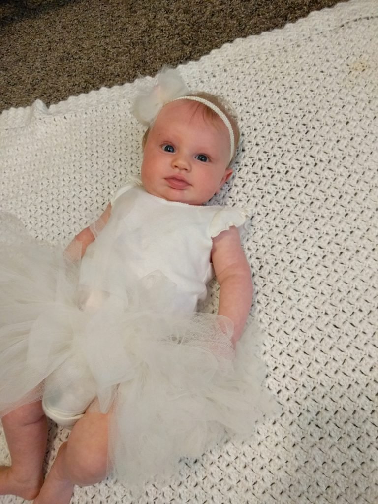 I guess a lot was going on on Sunday, because I completely forgot to get any pictures of the family with Portia. I took this picture as I was changing her into her pajamas for the night. Better late than never!