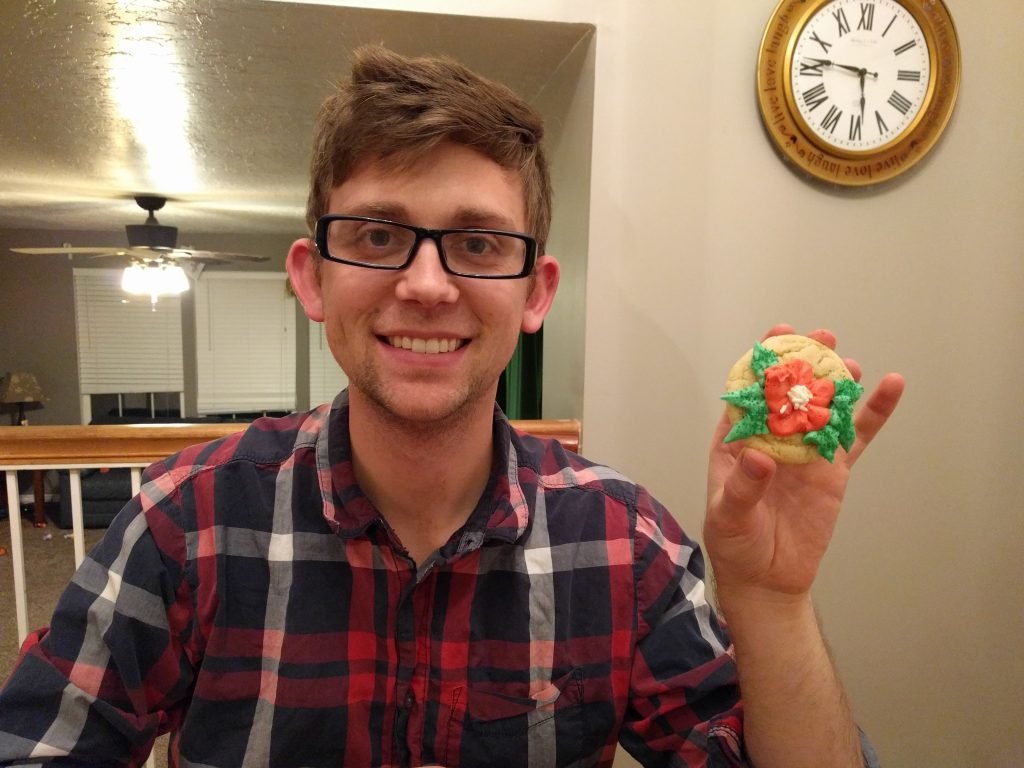 Josh with his poinsettia cookie! You gotta love his hair!